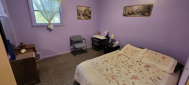 bedroom featuring dark carpet