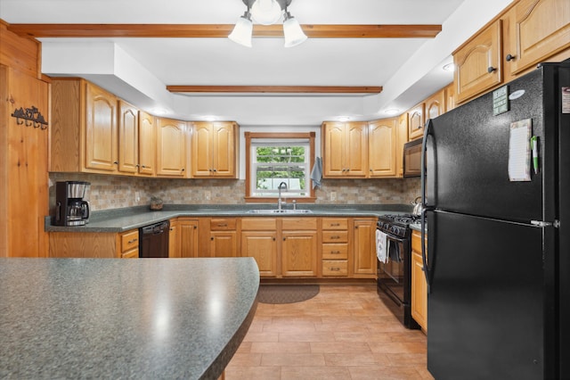 kitchen featuring beam ceiling, black appliances, backsplash, and sink