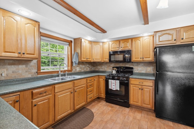 kitchen featuring beam ceiling, sink, black appliances, light wood-type flooring, and decorative backsplash