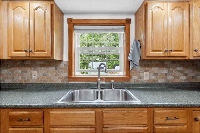 kitchen with backsplash and sink