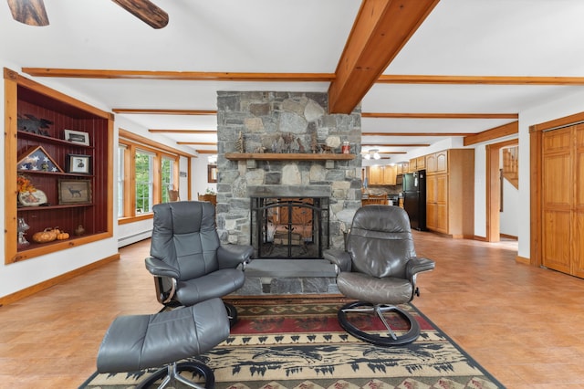 living room with a baseboard radiator, ceiling fan, beamed ceiling, and a stone fireplace