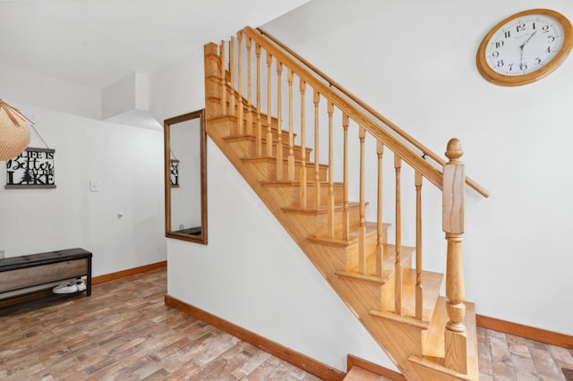 stairs with wood-type flooring