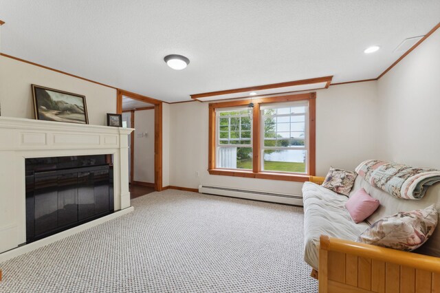 carpeted living room with a textured ceiling, ornamental molding, and a baseboard heating unit