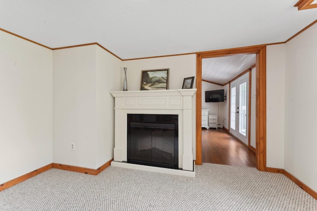 unfurnished living room featuring light carpet, a textured ceiling, french doors, and crown molding