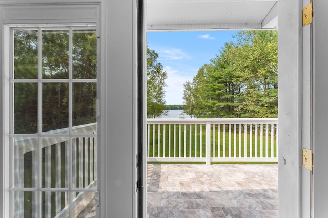 balcony featuring a water view