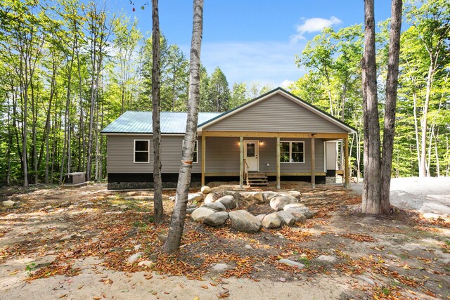 view of front of house featuring covered porch and central AC unit