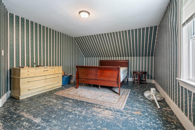 bedroom with baseboards and wallpapered walls