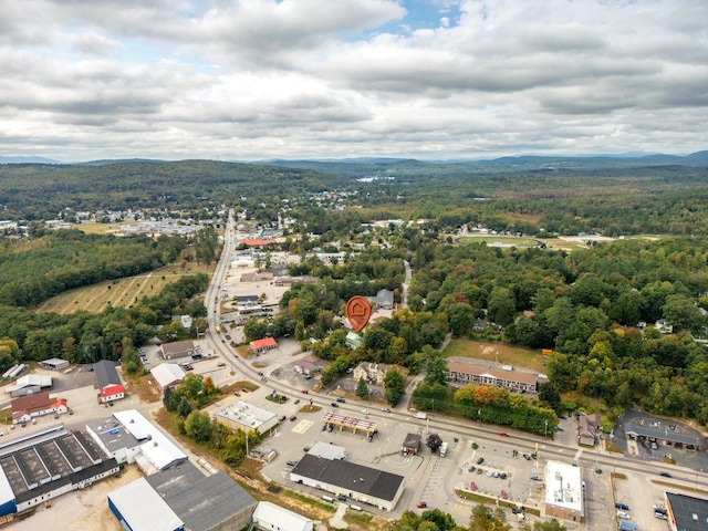 bird's eye view featuring a forest view and a mountain view