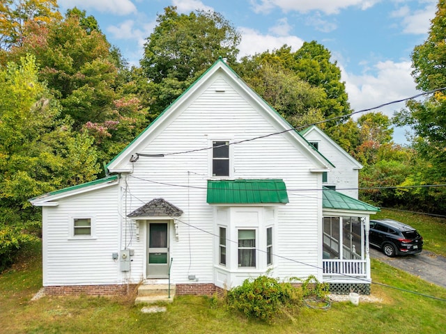 back of house with a yard