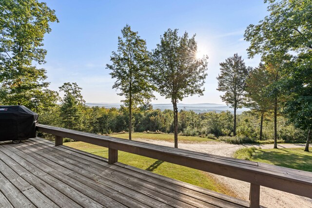 wooden deck featuring grilling area