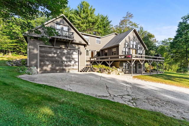 view of front of house featuring a garage, a balcony, a deck, and a front yard