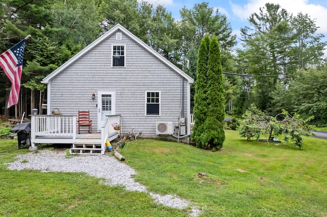 back of house featuring a lawn, a deck, and ac unit