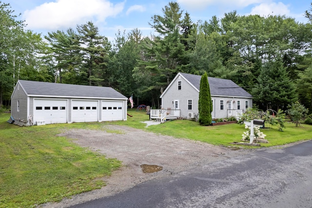 exterior space with a lawn, an outbuilding, and a garage