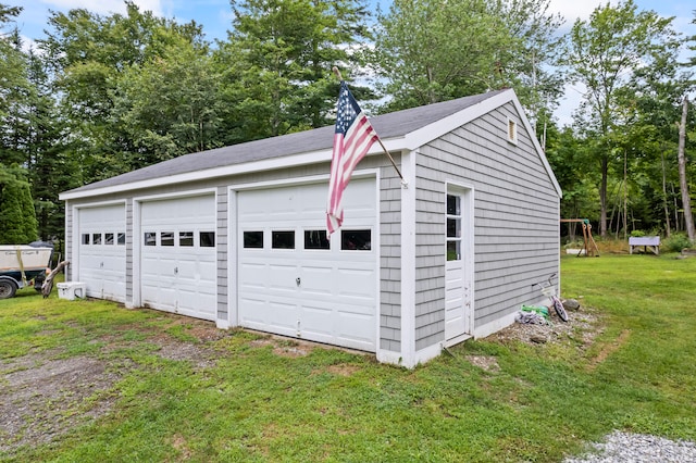 garage with a lawn