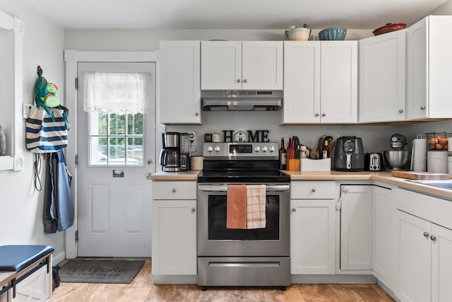 kitchen with white cabinets and electric stove