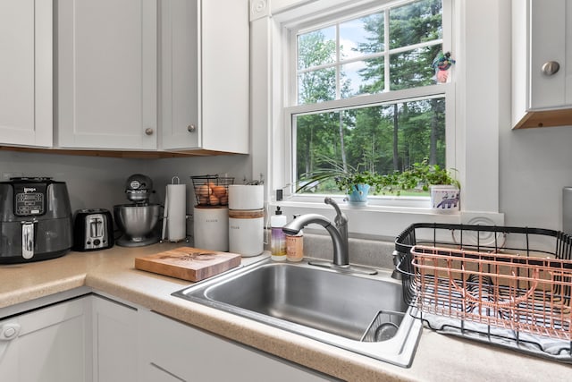 kitchen with white cabinets