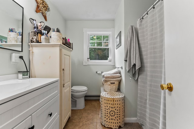 bathroom with tile patterned floors, vanity, and toilet