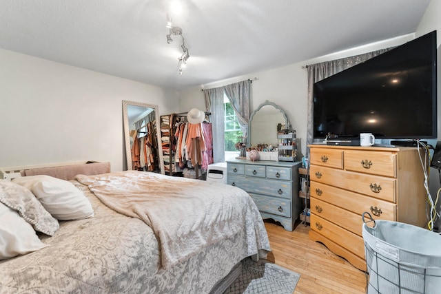 bedroom featuring light wood-type flooring