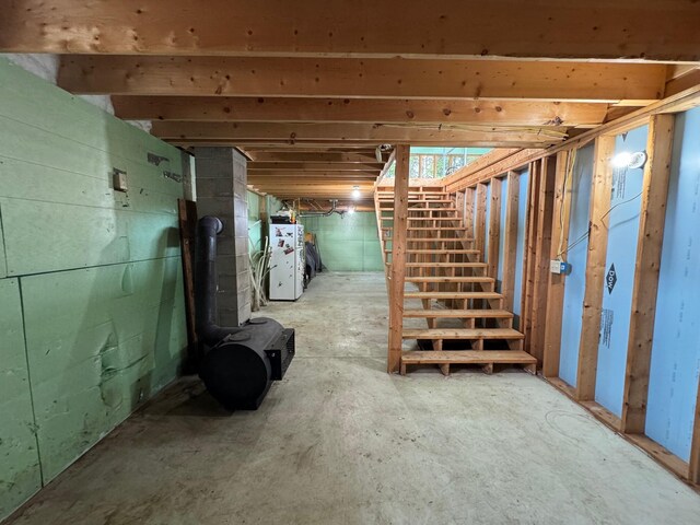 basement with white fridge