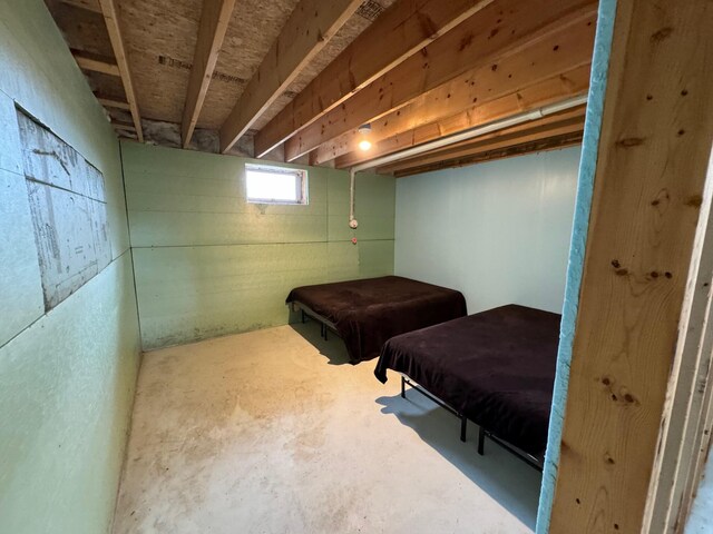 bedroom with pool table and concrete flooring