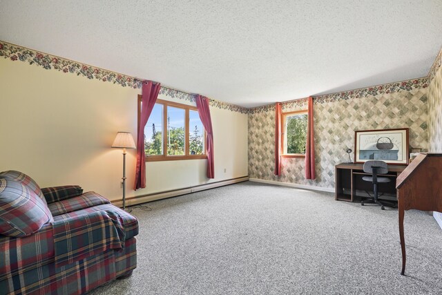 living area with a baseboard radiator, carpet, a textured ceiling, and a healthy amount of sunlight