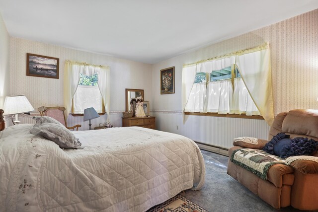 carpeted bedroom featuring baseboard heating