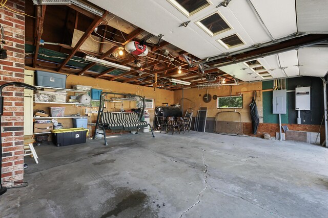 garage featuring a garage door opener and electric panel