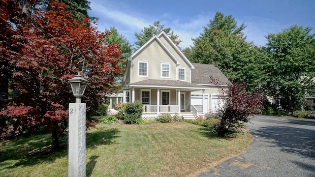 view of front of home with a front yard and a porch