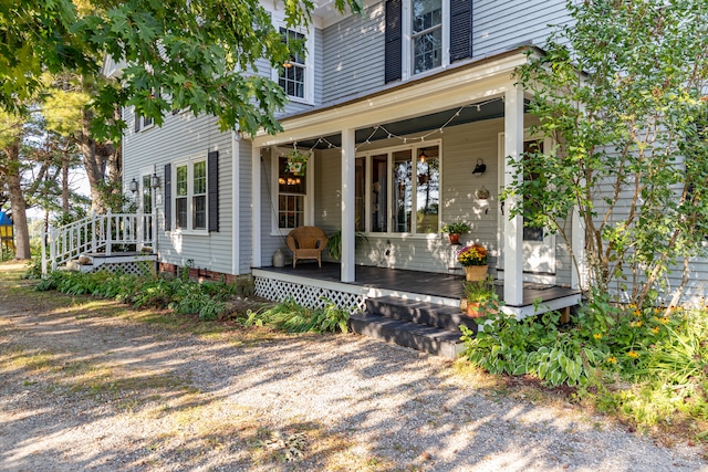 view of exterior entry featuring a porch