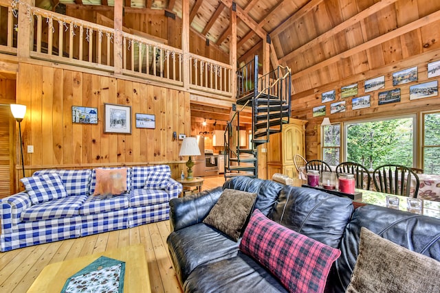 living room featuring wooden walls, wood ceiling, high vaulted ceiling, beam ceiling, and wood-type flooring