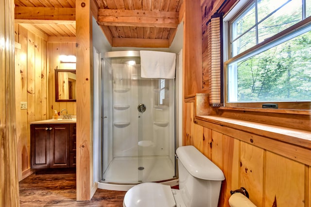 bathroom featuring wooden ceiling, wooden walls, plenty of natural light, beam ceiling, and an enclosed shower