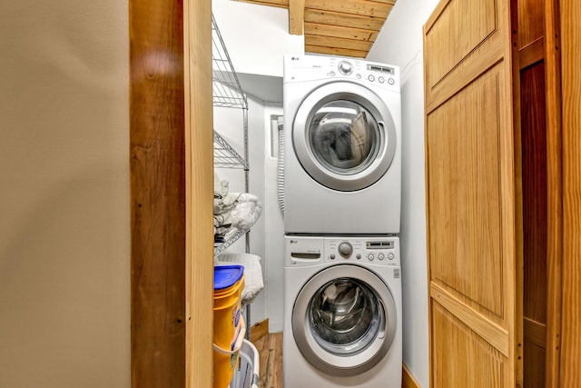 washroom with stacked washer and dryer