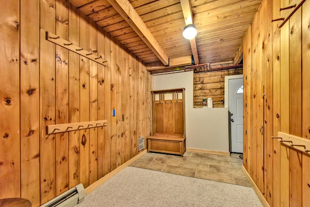 interior space with wooden ceiling, light colored carpet, beamed ceiling, wooden walls, and a baseboard heating unit