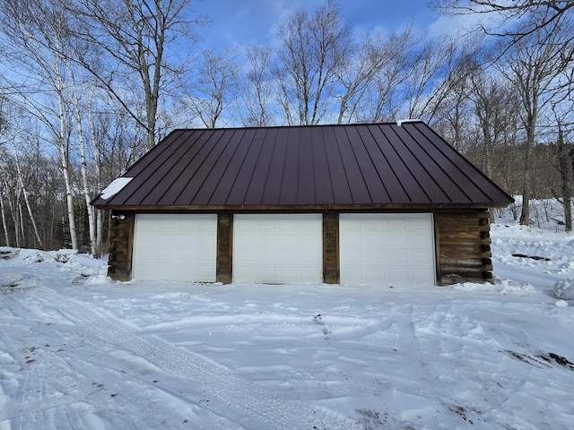 view of snow covered garage