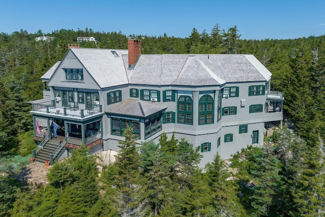 back of house with a balcony