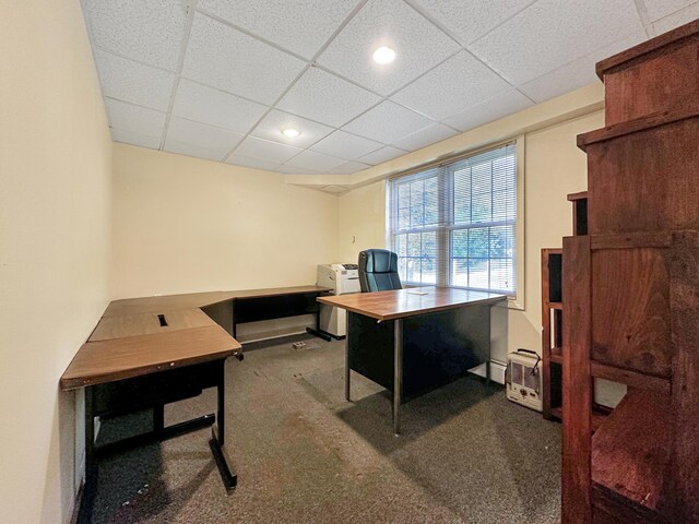 office space with a drop ceiling and carpet flooring