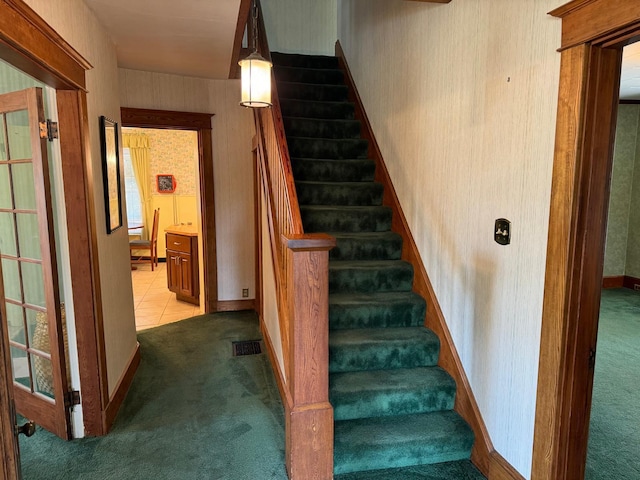 37 Fisher St, Fort Fairfield, ME 04742 - staircase featuring carpet floors, visible vents, and wallpapered walls