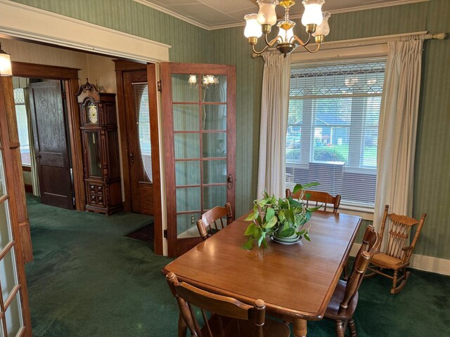 dining area with a notable chandelier, ornamental molding, and carpet