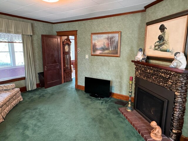 living area with a fireplace, crown molding, and carpet