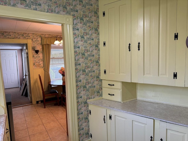 37 Fisher St, Fort Fairfield, ME 04742 - kitchen with white cabinetry, light tile patterned flooring, and wallpapered walls