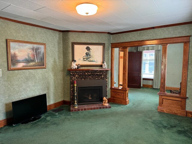 living room featuring crown molding, carpet, and a tile fireplace