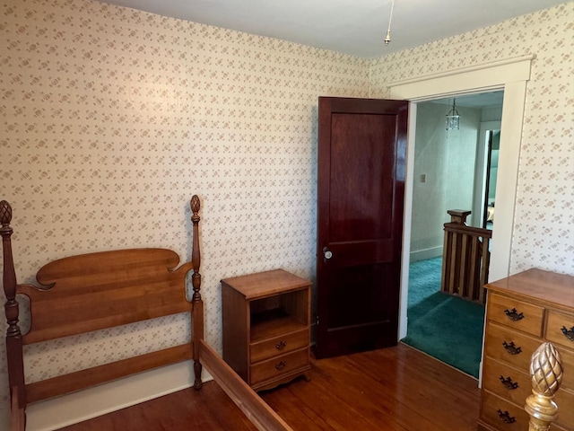 37 Fisher St, Fort Fairfield, ME 04742 - bedroom with dark wood-style floors and wallpapered walls