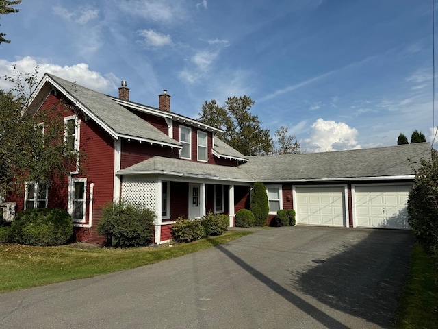 37 Fisher St, Fort Fairfield, ME 04742 - traditional home featuring a chimney, roof with shingles, a garage, and aphalt driveway