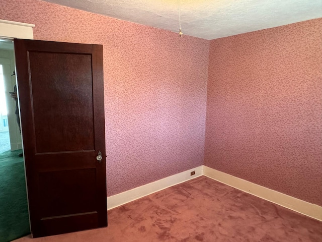 37 Fisher St, Fort Fairfield, ME 04742 - carpeted spare room with baseboards and a textured ceiling