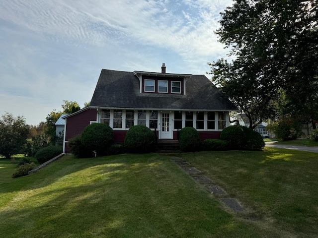 37 Fisher St, Fort Fairfield, ME 04742 - view of front facade featuring a front yard, a shingled roof, and a chimney