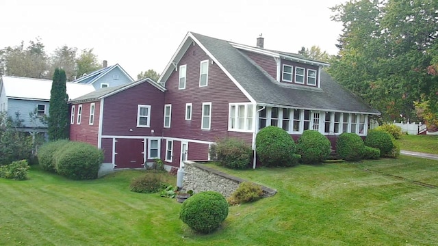37 Fisher St, Fort Fairfield, ME 04742 - rear view of house with roof with shingles, a chimney, and a lawn