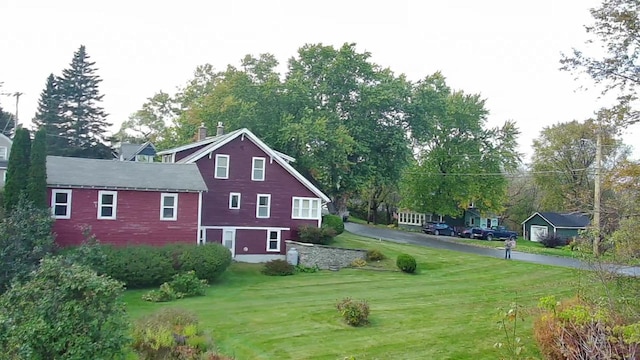 view of side of home featuring a lawn