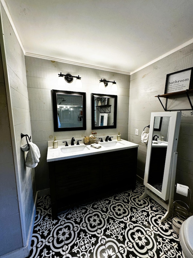 bathroom featuring ornamental molding, vanity, and toilet