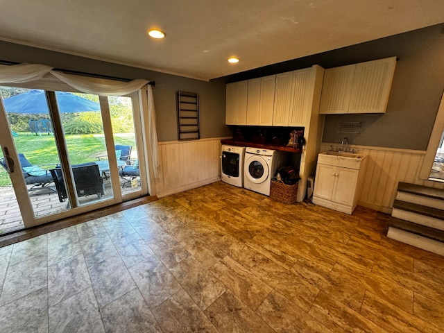 kitchen with sink and independent washer and dryer