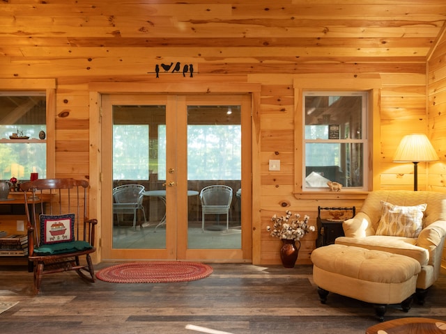 sitting room with wood walls, wood-type flooring, and wood ceiling